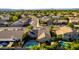 An aerial view displays a neighborhood and home with solar panels and a sparkling pool at 5731 W Gail Dr, Chandler, AZ 85226