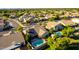 A stunning aerial view featuring a community and a home with solar panels and a pool at 5731 W Gail Dr, Chandler, AZ 85226