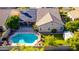 Aerial view showcases a backyard oasis, featuring a sparkling pool and lush greenery at 5731 W Gail Dr, Chandler, AZ 85226