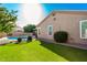 Backyard featuring a sparkling pool, artificial grass, and mature landscaping at 5731 W Gail Dr, Chandler, AZ 85226