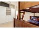 Inviting bedroom featuring wooden bunk beds, integrated white cabinets, and a mounted TV at 5731 W Gail Dr, Chandler, AZ 85226