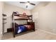 Bedroom featuring a bunk bed, ceiling fan, and closet at 5731 W Gail Dr, Chandler, AZ 85226