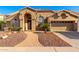 Inviting single-story home featuring a two car garage, desert landscaping and a brick walkway at 5731 W Gail Dr, Chandler, AZ 85226
