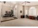 Expansive living room boasting tile floors, plantation shutters, and a ceiling fan at 5731 W Gail Dr, Chandler, AZ 85226