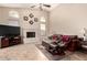 Inviting living room featuring a fireplace, vaulted ceilings, and comfortable seating area at 5731 W Gail Dr, Chandler, AZ 85226