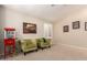 Inviting seating area with carpet, plantation shutters and a vintage popcorn machine at 5731 W Gail Dr, Chandler, AZ 85226