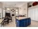 Open living area featuring a fireplace and stylish kitchen island with granite countertops at 5731 W Gail Dr, Chandler, AZ 85226