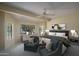 Relaxing bedroom showcasing ample natural light and comfortable seating for a tranquil space at 6101 E Beck Ln, Scottsdale, AZ 85254