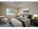 Bright bedroom with a comfortable bed, side chair, and a calming, neutral color palette at 6101 E Beck Ln, Scottsdale, AZ 85254