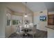 Cozy dining area with large windows and a view, next to kitchen counter at 6101 E Beck Ln, Scottsdale, AZ 85254