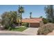 Charming single-story home with a tile roof, lush landscaping, and a two-car garage at 6101 E Beck Ln, Scottsdale, AZ 85254