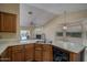 Spacious kitchen features wooden cabinets, a view to the backyard, and ample counter space at 6101 E Beck Ln, Scottsdale, AZ 85254