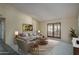 Bright living room with a comfortable seating area and access to an outdoor space at 6101 E Beck Ln, Scottsdale, AZ 85254