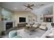 Inviting living room boasts a fireplace, media center, and an open layout into the dining area at 6101 E Beck Ln, Scottsdale, AZ 85254