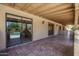 Extended covered patio with tile flooring and views of the pool at 6101 E Beck Ln, Scottsdale, AZ 85254