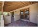 Charming covered patio with terracotta tile floor featuring access to the home's interior at 6101 E Beck Ln, Scottsdale, AZ 85254