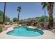 Backyard pool with mature landscaping and palm trees at 6101 E Beck Ln, Scottsdale, AZ 85254