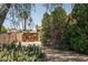 Lush yard with mature trees, landscaping and privacy fence at 6101 E Beck Ln, Scottsdale, AZ 85254