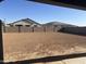 Large backyard with dirt and block wall, ready for landscaping at 713 W Longwood Dr, Queen Creek, AZ 85140