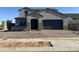 Charming two-story home with a well-manicured front yard and a two-car garage at 713 W Longwood Dr, Queen Creek, AZ 85140