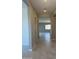 Bright hallway with tile flooring, leading to a spacious living area at 713 W Longwood Dr, Queen Creek, AZ 85140