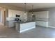 Bright kitchen with stainless steel appliances, granite countertops, and white cabinetry at 713 W Longwood Dr, Queen Creek, AZ 85140