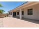 Covered back patio with neutral columns and paved flooring at 7205 W Ellis St, Laveen, AZ 85339