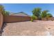 Large backyard with gravel landscaping and privacy wall at 7205 W Ellis St, Laveen, AZ 85339