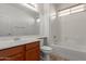 Well-lit bathroom with a tub and shower, and a single sink vanity at 7205 W Ellis St, Laveen, AZ 85339