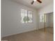 Bedroom with window, ceiling fan and mirrored closet at 7205 W Ellis St, Laveen, AZ 85339