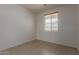 Bedroom with a window, offering natural light and simple elegance at 7205 W Ellis St, Laveen, AZ 85339
