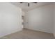 A clean and simple bedroom featuring an open doorway at 7205 W Ellis St, Laveen, AZ 85339