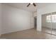 Bedroom with a ceiling fan and sliding mirror closet doors at 7205 W Ellis St, Laveen, AZ 85339