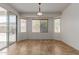 Cozy dining area with lots of natural light is situated near a sliding glass door at 7205 W Ellis St, Laveen, AZ 85339