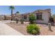 Charming single-story home featuring desert landscaping, a neutral color palette, and a two-car garage at 7205 W Ellis St, Laveen, AZ 85339