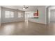 Open-concept living room featuring wood-look floors and a kitchen bar at 7205 W Ellis St, Laveen, AZ 85339