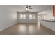 Spacious living room featuring wood-look floors and an eat-in kitchen at 7205 W Ellis St, Laveen, AZ 85339