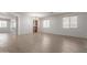 Spacious living room with wood-look floors and natural light at 7205 W Ellis St, Laveen, AZ 85339