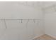 Organized walk-in closet featuring white shelving for ample storage space at 7205 W Ellis St, Laveen, AZ 85339