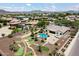 Expansive backyard features a pool, spa, outdoor kitchen, fire pit, and a putting green at 7205 W Fallen Leaf Ln, Peoria, AZ 85383