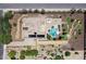Aerial view of the backyard showing the layout of the home, pool, putting green, and garden at 7205 W Fallen Leaf Ln, Peoria, AZ 85383