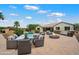 Beautiful backyard featuring a pool, fire pit, seating area and covered patio, perfect for outdoor living at 7205 W Fallen Leaf Ln, Peoria, AZ 85383