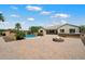 Spacious backyard with a pool, fire pit, and covered patio, ideal for entertaining and relaxation at 7205 W Fallen Leaf Ln, Peoria, AZ 85383