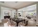 Elegant dining room with stylish furniture and a modern light fixture, perfect for entertaining guests at 7205 W Fallen Leaf Ln, Peoria, AZ 85383