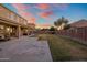 Large backyard with spacious covered patio and large grassy area perfect for enjoying the outdoors at 7616 S Sorrell Ln, Gilbert, AZ 85298