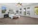 Inviting bedroom with a ceiling fan and natural light, and access to a private balcony at 7616 S Sorrell Ln, Gilbert, AZ 85298
