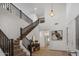 Spacious entryway featuring a staircase, high ceilings, and modern decor at 7616 S Sorrell Ln, Gilbert, AZ 85298