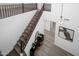 Bright foyer featuring stylish light fixture and staircase leading to the upper level at 7616 S Sorrell Ln, Gilbert, AZ 85298