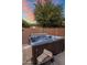 Hot tub on a patio with towels for relaxation at 7616 S Sorrell Ln, Gilbert, AZ 85298