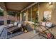 Relaxing patio with lounge chairs, side tables, and elegant decor at 7616 S Sorrell Ln, Gilbert, AZ 85298